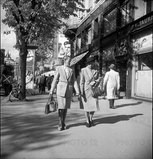 People passing by in Zurich, 1950