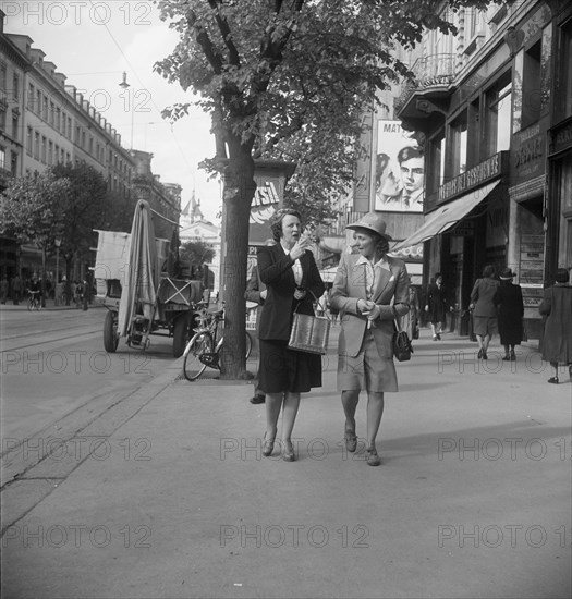 People passing by in Zurich, 1950