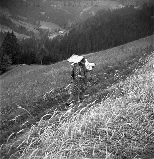 Young woman bringing her textiles to the railway station 1964