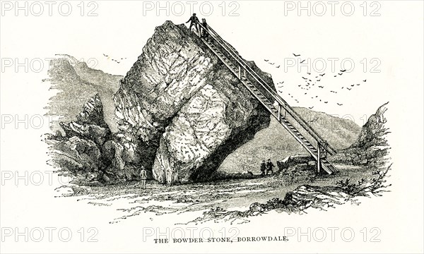 Bowder Stone in Borrowdale. The Bowder Stone is a large andesite lava boulder, that fell 200 metres from the Bowder Crag on Kings How between 13,500 and 10,000 years ago. The stone is situated in Borrowdale, Cumbria, England. The Bowder Stone is right in the 'Jaws of Borrowdale' - the narrow point where the road winds beneath overhanging crags. This house-sized boulder has come to rest improbably on one edge and has been the quirkiest tourist attraction in the lakes since Georgian times as you can climb up its ladder.