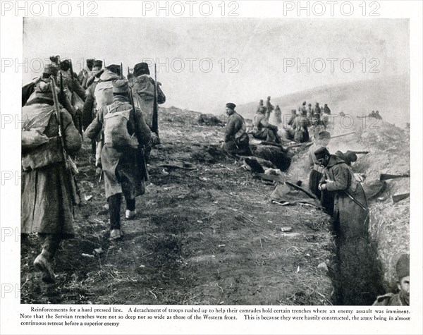 Reinforcements for a hard pressed line. A detachment of troops rushed up to help their comrades hold certain trenches where an enemy was imminent. Note that the Servian trenches were not so deep not so wide as those of the Western front. This is because they were hastily constructed, the army being in almost continuous retreat before a superoior enemy.