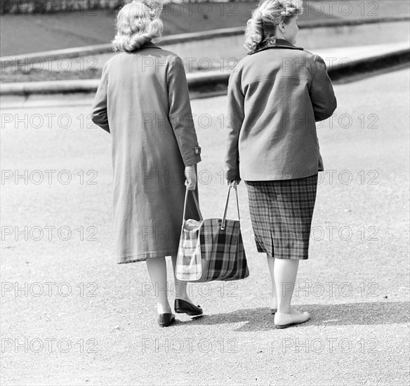 Women with shopping bag, circa in 1955.