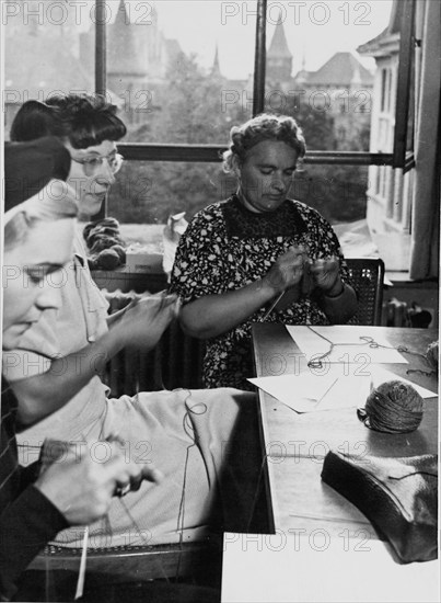 Women from french speaking part of Switzerland knitting for soldiers, around 1939.