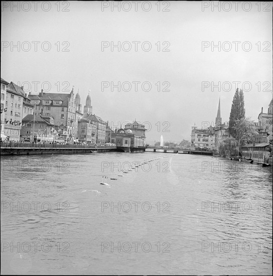 Zurich Festival 1953; fountain in the distance, Limmat river.