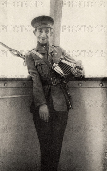 This photo shows Private Peat who fought in World War I. The caption reads: Still smiling though his right arm useless.  It appeared in Harold R Peat's book 'Private Peat' published in 1917.