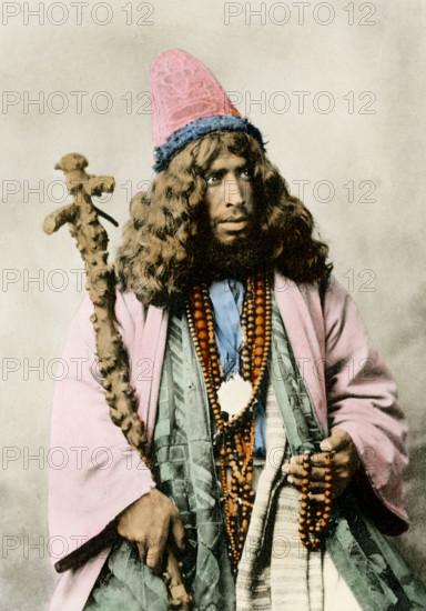 This image of a Howling or Whirling Dervish dates to 1903.  A dervish is a member of any of various Muslim ascetic orders, some of which perform whirling dances and vigorous chanting as acts of ecstatic devotion. Dervishes are known for their worship rituals which require a dervish to spin very fast causing his clothing to fan out in a circle. The men wear large circular skirts to capitalize on this effect.