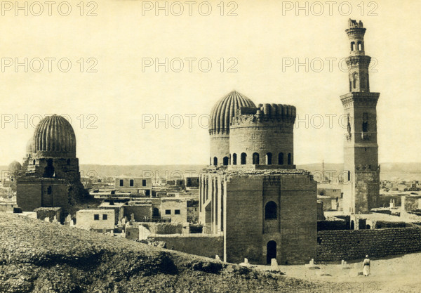 This photo dates to around 1900 and shows the Tombs of the Mamluks in Cairo. The Mamluks were slave soldiers and served the Muslim caliphs and the Ottoman Empire. As the decades passed they became a powerful caste, on accasion, seizing power for themselves. The Mamluk Sultanate of Egypt began in 1250 and ended in 1517 when the Ottomans took control of Egypt. Toward the end of the 14th century, the Mamluk rulers began looking for a new necropolis for themselves and established a cemetery in northern Cairo, the area known as Qarafa. The area is also known as the City of the Dead and the Cairo Necropolis.