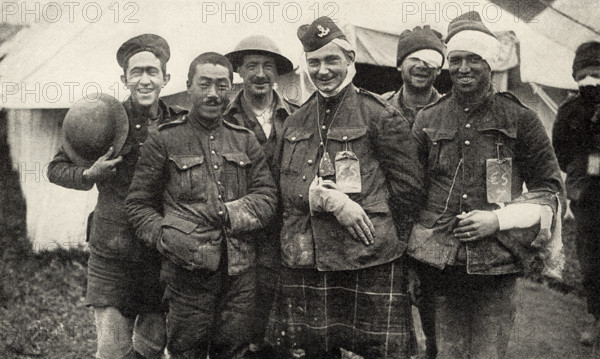 This photo shows Canadian troops who fought in World War I. The caption reads: Cheerful Beggars.  It appeared in Harold R Peat's book 'Private Peat' published in 1917.