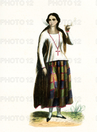 This 1840s illustration shows a lady from the island of Guam. Guam is a U.S. island territory in Micronesia, in the Western Pacific. Guam is part of the area of the world known as Oceania. Oceania is a geographic region that includes Australasia, Melanesia, Micronesia and Polynesia. Spanning the Eastern and Western Hemispheres, Oceania has a land area of 8,525,989 square kilometers.