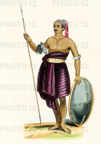 This 1840s illustration shows a warrior from the island of Savu. Savu is the largest of a group of three islands, situated midway between Sumba and Rote, west of Timor, in Indonesia's eastern province, East Nusa Tenggara. Ferries connect the islands to Waingapu on Sumba, Ende on Flores, and Kupang in West Timor. Savu is part of the area of the world known as Oceania. Oceania is a geographic region that includes Australasia, Melanesia, Micronesia and Polynesia. Spanning the Eastern and Western Hemispheres, Oceania has a land area of 8,525,989 square kilometers.