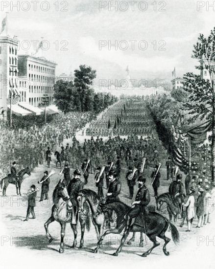 The 1903 caption reads: ""Grand Review at Washington May 24 and 25, 1965."" On May 23 and 24, 1865, before the soldiers were mustered out of the Union Army, a Grand Review of the Armies was held in Washington, D.C., to honor the victorious troops. President Andrew Johnson also hoped to elevate the mood of a city that was devastated by the loss of President Abraham Lincoln.