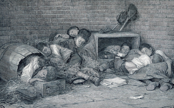 This late 19th-century illustration shows supperless and homeless street boys sleeping out at night - a night scene in an alley. Many of the newsboys and street boys of New York have no homes. Driven out from the alleys and by-ways of the slums, and from the dens in tenement districts, where most of them were born, they sell papers, black shoes, beg or steal, as need be, and sleep wherever night overtakes them. Their faces are old from constant exposure as well as from the struggle for existence. Their thin clothes afford small protection against winter's cold. It is not til one sees them at night curled up on some doorway in old barrels and empty packing boxes lying in any way and every sheltered spot in dark alleys or deserted hallways that one begins to realize that there is no softer pillow for them.