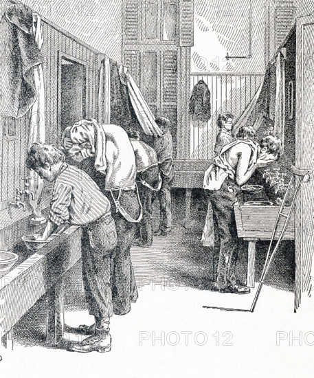 This late 19th-century illustration shows homeless boys in a washroom in New York City. The caption reads: The washroom on the newsboys lodging house just before supper time.