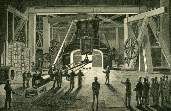 This illustration dates to the 1870s and shows the Great Steam Hammer Royal Gun Factory Woolwich. The hammer was, at the time, thought to be one of the most powerful steam hammers ever constructed. Its purpose was to forge great guns for the British Navy. The hammer was made by Nasymth & Co. Its height is about 50 feet and it is surrounded with furnaces and powerful cranes, carrying the huge iron tomgs that are to grap the glowing masses. Th hammer descend not merely with its own weight of 30 tons; steam is injected behind the falling piston, which is thus driven down with vastly enhanced rapidity and impulse.