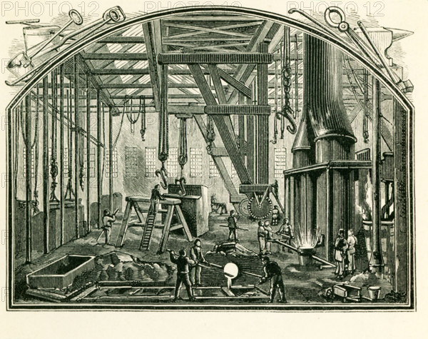 This illustration dates to the 1870s and shows a foundry, a workshop or factory for casting metal, in England in the 1870s.