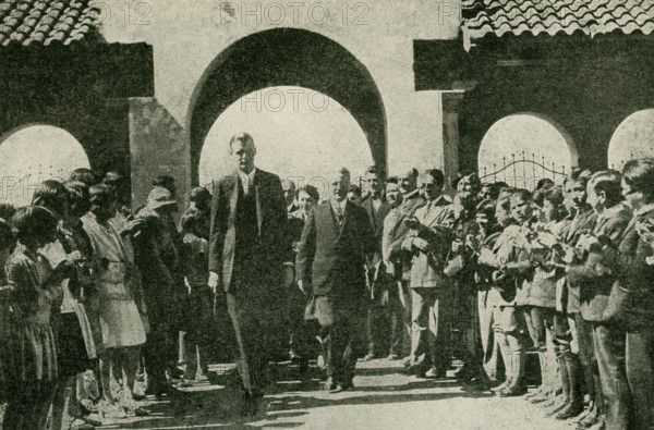 The caption for this photo reads: Colonel Lindbergh in Mexico after his non-stop flight from Washington. Hardly less spectacular than his flight across the Atlantic was Colonel Lindbergh's non-stop flight from the capital of the United States to the capital of Mexico, Dec 13-14, 1927, a total flying distance of 2100 miles. He was hailed enthusiastically as the ""Ambassador of Good-will."".