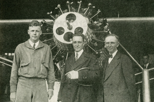 The caption reads:  Three Transatlantic Flyers. At the left is Colonel Charles A. Lindbergh, who was the first to fly from New York to Paris, May 20-21, 1927. In the center is Commander Richard E. Byrd, who was first to fly to the Pole, and who, with Bert Acosta, Bernt Balchen, and George O. Noville, flew from New York to France, June 29-30, 1927. At the right is Clarence  D. Chamberlain, who with Charles A Levine, flew from New York to Eisleben, Germany, June 4-6, 1927.