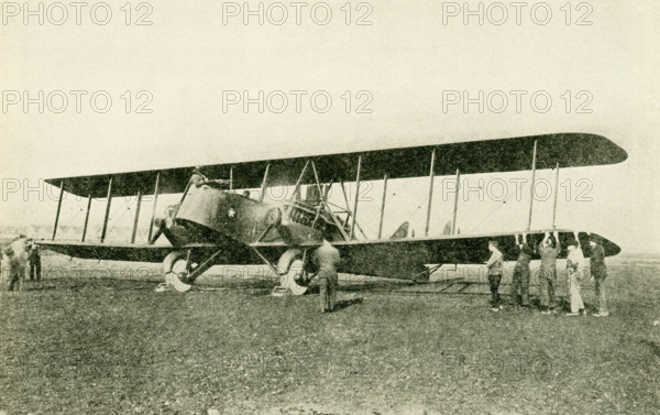 One of the Army giant bombing planes. This Martin bomber is powered with two 400 horse-power Liberty motors which give it a maximum speed of 97 1/2 milesa per hour. The great size of this plane (74 feet wide by 42 feet long) is necessary to carry the crew of four men together with its armament of machine guns and bombs.