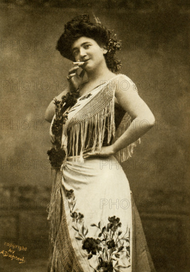 This photo shows the opera singer Emma Calve in the title role of Bizet's Carmen. She was born in 1866 in Decazeville, France, and made her operatic debut in Brussels in 1881, as Marguerite in Faust. She originated the role of Santuzza in Cavalleria Rusticana, but her greatest triumphs followed her first appearance in Carmen at the Opera Comique, Paris, in 1874. She first came to America in 1893 and then made yearly visits in grand opera and recitals.