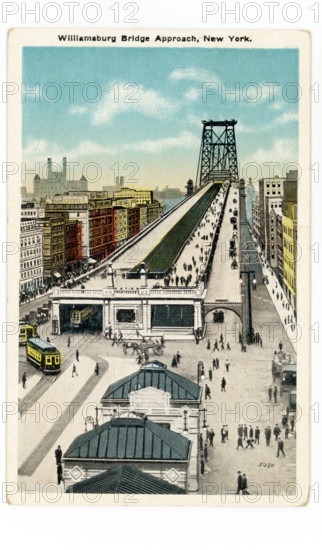 This 1930s postcard shows the approach to Williamsburg Bridge in New York City. The bridge is a suspension bridge across the East River, connecting the lower East Side of Manhattan at Delancey Street with the Williamsburg neighborhood at Brooklyn. The bridge opened in 1903. At the time it was the longest suspension bridge span in the world.