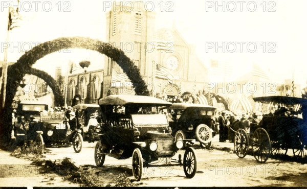 This photo predates 1924 and was taken at the Feast of Blessed Sacrament in New Bedford, Massachusetts, was taken from Dimon Street. The Feast of the Blessed Sacrament was an annual festival that was celebrated and hosted by Immaculate Conception Catholic Church in the north end of New Bedford.