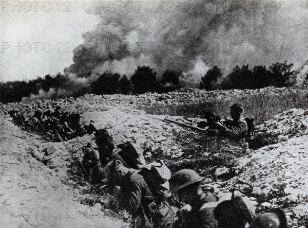 The caption on this photo that dates to the early 1920s reads: Americans in shell holes in No Man's Land preparing for the gas waves coming toward them.