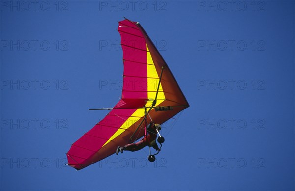 10036941 SPORT Air Gliding View looking up at hang glider in the sky.