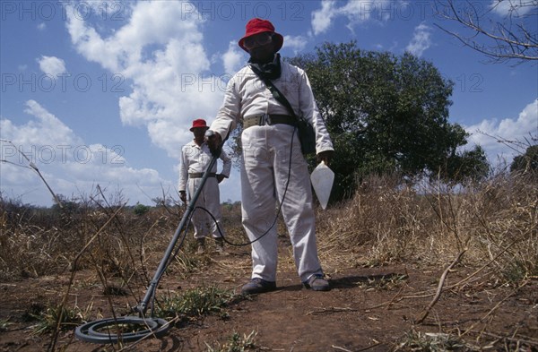 MOZAMBIQUE, Dombe, People, Mine Clearance Team at work in fields.