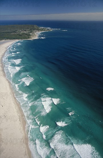 SOUTH AFRICA, Cape Province, Cape Town, View along Noordhoek Beach with waves rolling into the empty beach
