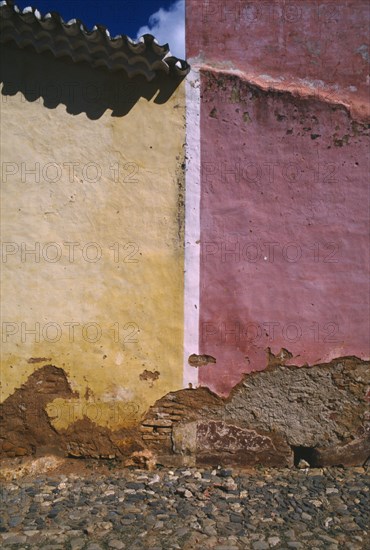 CUBA, Sancti Spiritus, Trinidad, Detail of red and yellow walls split by white line
