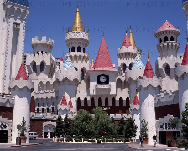 USA, Nevada, Las Vegas, Excalibur Hotel and Casino. Chateau facade of hotel entrance with pink and gold turrets.