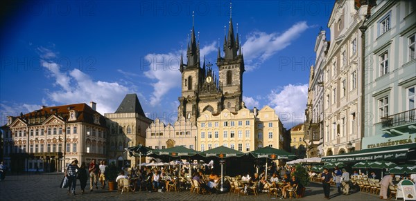 CZECH REPUBLIC, Stredocesky, Prague, View across Old Town Square toward Tyn Church with busy pavement cafes in the foreground.