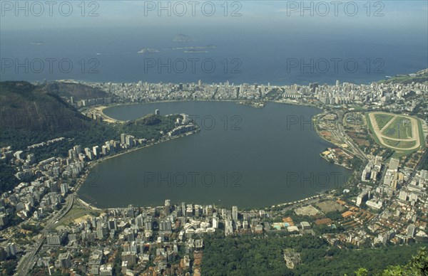 BRAZIL, Rio de Janeiro, Aerial view over Lake Rodrego de Freitas and surrounding area with the sea beyond
