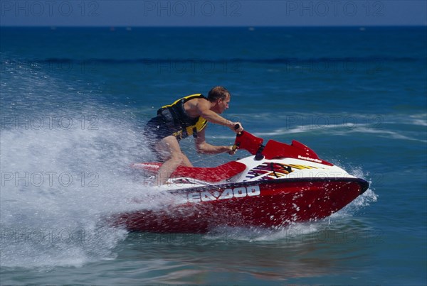 20001991 SPORT Water Sports Jet Ski Person on a red jet ski in action