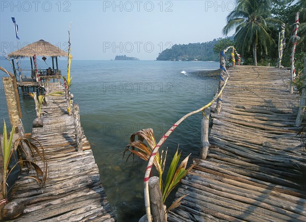THAILAND, Trat Province, Koh Chang, "Lonley Beach, Aow Bai Lan. Bridge leading to a wooden platform built over the sea."