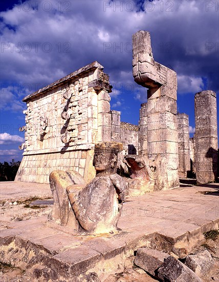 MEXICO, Yucatan, Chichen Itza, Reclining figure in foreground