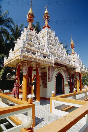 MALAYSIA, Penang, Georgetown, Dharmikarama Burmese Temple.  Exterior with ornate carved roof and statues.