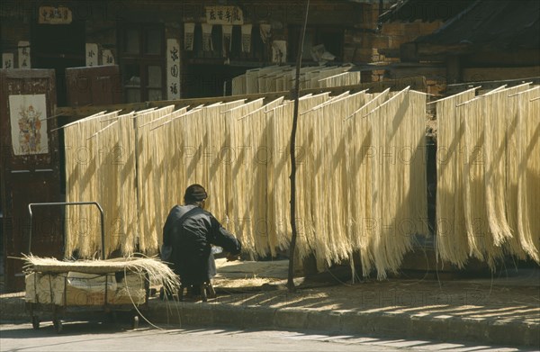 CHINA, Guizhou Province, Kaili, Noodles hanging up to dry.