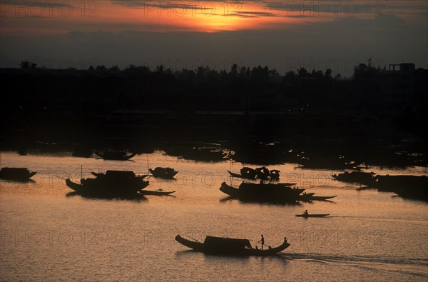 VIETNAM, Hue, Boats on the Perfume River at sunset.