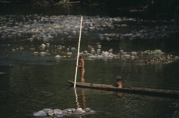 PANAMA, Children, Embera Indian children on wooden canoe.