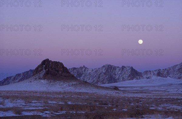 MONGOLIA, "				", Hovd Province, Mountains lightly covered in snow at sunset with pink sky. Rtnd 2 VKB 15/5/2009