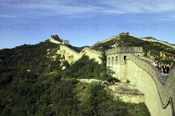 CHINA, Great Wall, View alongside a section of the wall which runs through the hilly green landscape
