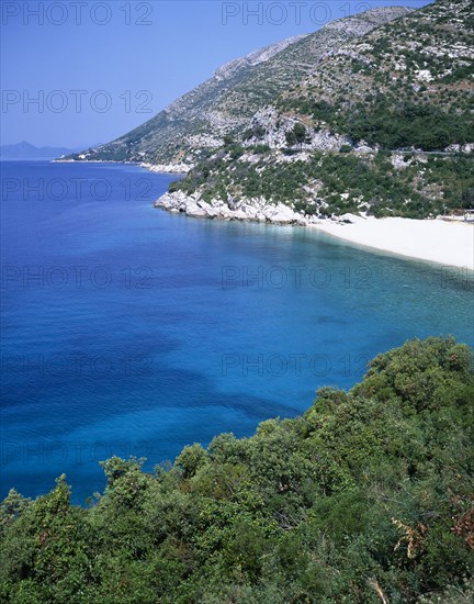 CROATIA, Dalmatia, Makarska Coast , Gradac. View along the rocky coastline with small sandy beach on the right