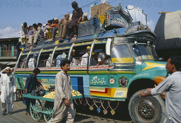 PAKISTAN, Transport, Crowded colourful bus in Khwakakhela Swat area.