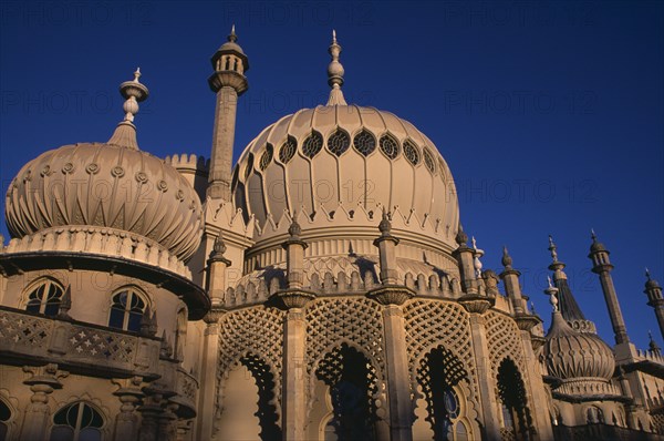 ENGLAND, East Sussex, Brighton, Brighton Pavilion exterior section showing onion domes in evening light