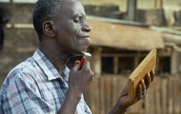 GHANA, Grooming, Washing & Cleaning, Man shaving.