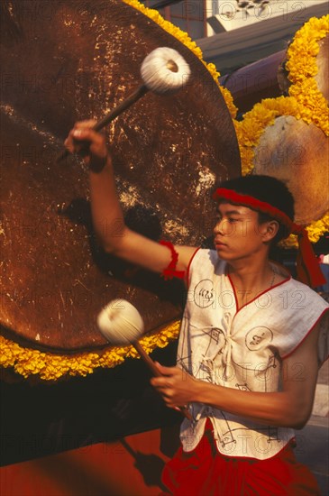 THAILAND, Chiang Mai, Traditional Thai drummer with large drum in the Flower Festival parade