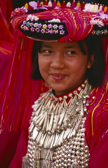 THAILAND, Chiang Rai Province, Huai Khrai, Portrait of a young Lisu girl in her New Year finery