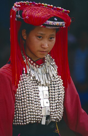 THAILAND, Chiang Rai Province, Huai Khrai, Portrait of a young Lisu woman wearing her New Year finery