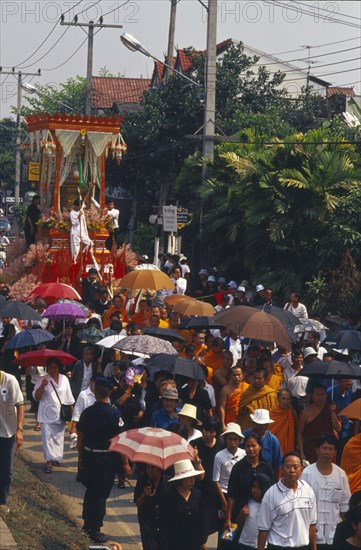 THAILAND, Chiang Mai, Revered monks funeral procession to cremation grounds with people pulling the funeral carriage